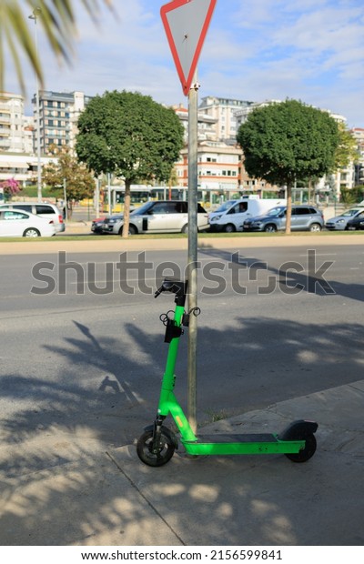 Kick scooter, electric scooter in the city\
park on the street on a summer\
day