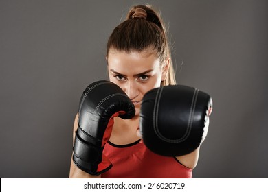 Kickbox Girl Delivering A Left Jab, Studio Shot