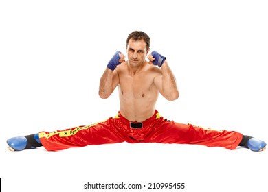 Kickbox or muay thai fighter executing a split, isolated on white background - Powered by Shutterstock