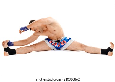 Kickbox or muay thai fighter isolated on white, stretching before training