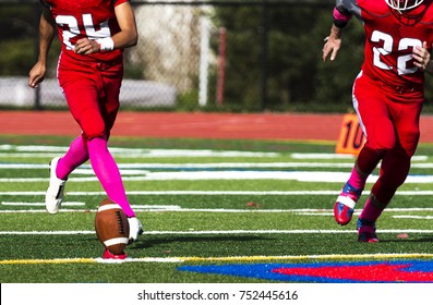 The Kicker Is Approaching The Football To Kick It Off And Start The Game.