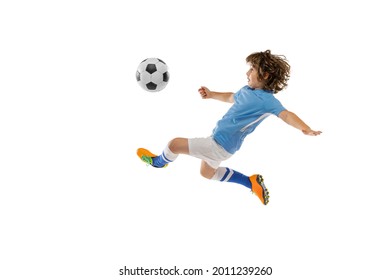 Kicking ball in flight. Young preschool boy, soccer football player in action, motion training isolated on white studio background. Concept of sport, movement, energy and dynamic, healthy lifestyle. - Powered by Shutterstock