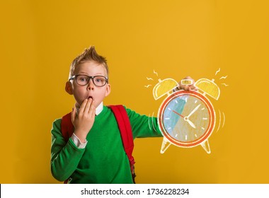 Kid With Alarm Clock In Hand. Worry To Be Late. Back To School