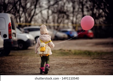 Kid All Alone On Car Parking. Lost Child With Baloon. Toddler Finding Parents. Watch The Baby.