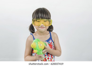 Kid Asian Girl  Holding Plastic Water Gun At Songkran Festival, Thailand.