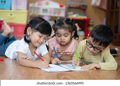 Kid Asian student doing homework .Kid enjoy learning with happiness at home. Education concept. - Shutterstock ID 1363566995