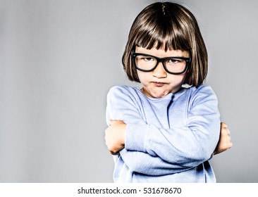 Kid Body Language With Sulking, Pouting Small Child Crossing Her Arms Expressing Attitude, Anger And Frustration, Contrast Effects, Copy Space