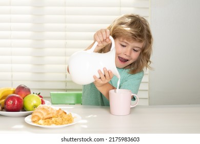 Kid bot eating meal. Healthy nutrition for children. Child enjoy eating for breakfast or dinner with appetite. Fuuny little boy pouring whole cows milk for breakfast.