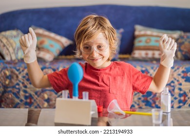 Kid boy doing chemical experiment at home. Child with protective glasses study using pipette dropping liquid to test tube, caucasian, biochemistry. chemistry class. home school concept - Powered by Shutterstock