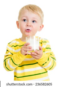 Kid boy drinking yoghurt from glass isolated