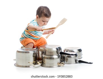 kid boy drumming playing with pots