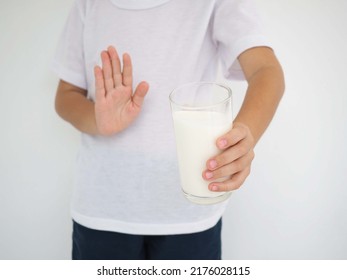 Kid Boy Feels Bad, Has An Upset Stomach, Bloating Due To Lactose Intolerance. Dairy Intolerant Person. Closeup Photo, Blurred.