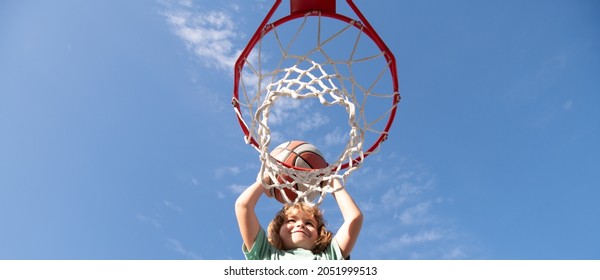 Kid Boy Playing Basketball, Banner With Copy Space. Child Playing Basketball Outdoors Shooting Slam Dunk.