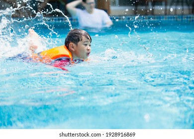 kid boy swimming pool exercise in holiday activities. swim practice sports. - Powered by Shutterstock