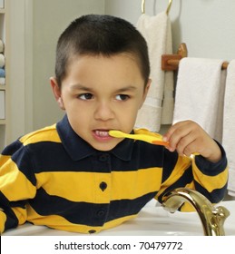 Kid Brushing Teeth In Front Of A Mirror, Hispanic, Four Years Old