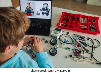 Kid Building Robot With Online Robotic Technology Lesson