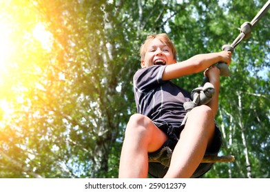 Kid Bungee jumping in the Summer Forest