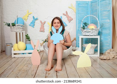 Kid Celebrate Easter. Funny Happy Girl Playing With Easter Eggs. Child Having Fun On Easter Egg Hunt. Home Decoration, Colorful Easter Eggs 