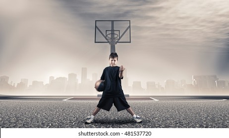 Kid Challenging To Play Basketball .

