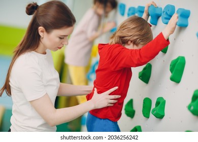 Kid child at climbing wall. Children sport, healthy lifestyle in kindergarten or sport center in school. - Powered by Shutterstock