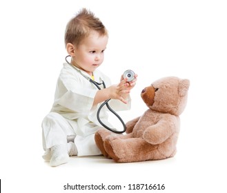 kid or child playing doctor with stethoscope and teddy bear isolated on white