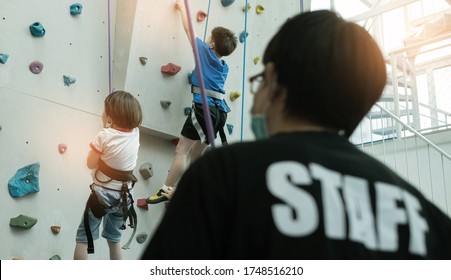 Kid Climbing A Wall, Children Rock Climbing

