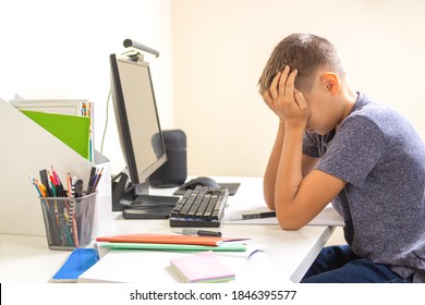 Kid With Computer Doing Homework At Home. Learning Difficulties, Online Learning, Education Concept