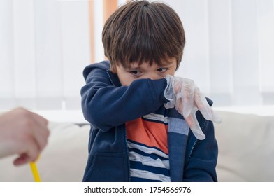 Kid Covering Nose And Mouth With His Arm, Child Having Allergy And Sneezing While Doing Science Project,Kid Scratching Nose, Children Has Reflection Or Hay Fever From Dusty,Allergies And Asthma In Kid