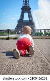 The Kid Is Crawling. Eiffel Tower And Baby. Trocadero.