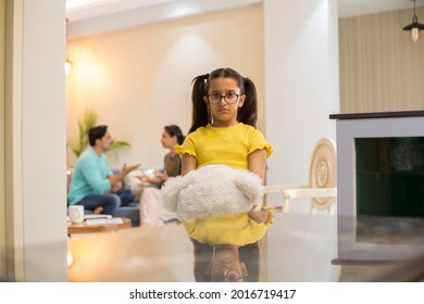 Kid Daughter Feels Upset While Parents Fighting At Background.