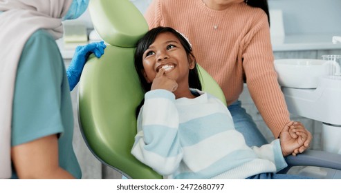 Kid, dentist and appointment for teeth or oral health education for prevention on tooth decay or hygiene. Little girl, mom and together for dentistry checkup or dental examination with orthodontist. - Powered by Shutterstock