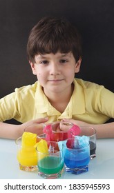 Kid Doing A Experiment With Coloured Water