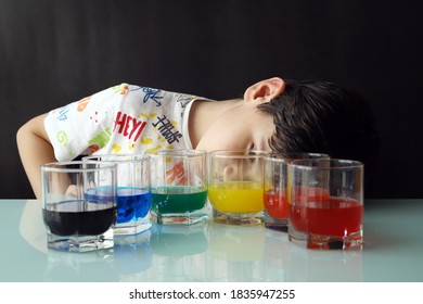 Kid Doing A Experiment With Coloured Water