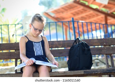 Kids Reading On A Bench Stock Photos Images Photography