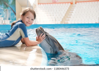 Kid and Dolphin. playing bottlenose dolphin. Dolphin Assisted Therapy