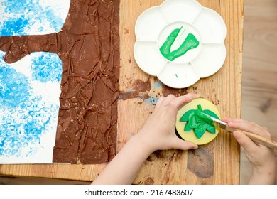 Kid Draws A Large Tree In Gouache. Children Activities, Easy Ideas At Home. Art Lessons On The Theme Of Spring. DIY Tasks For Children. Early Education.