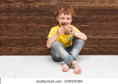 The Kid Drinking Cocoa At Home.