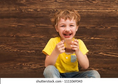 The Kid Drinking Cocoa At Home.