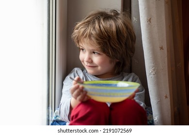 Kid Eating Breakfast. Child Eating Healthy Food.