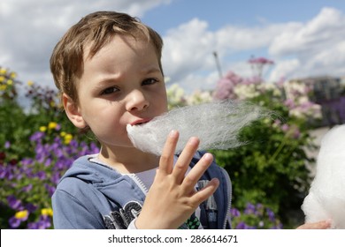 Kid Eating Fairy Floss In The Park