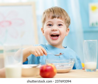 Kid Eating Healthy Food At Home Or Kindergarten