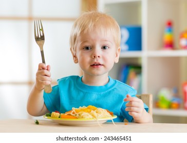 Kid Eating Healthy Food At Home Or Kindergarten