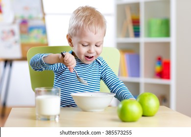 Kid Eating Healthy Food At Home Or Kindergarten