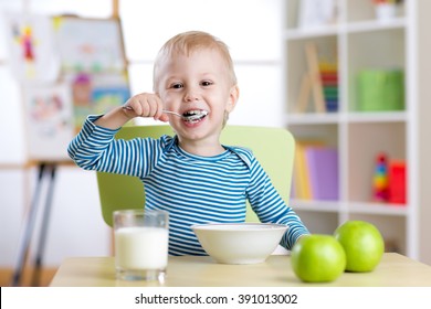 Kid Eating Healthy Food At Home Or Kindergarten