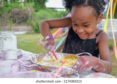 Kid enjoying with art, Black girl making master piece of art happily, Talent child good at art skill