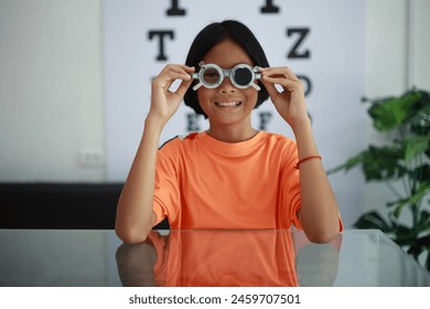 Kid eye test in optical store, child eye exam in optical store - Powered by Shutterstock