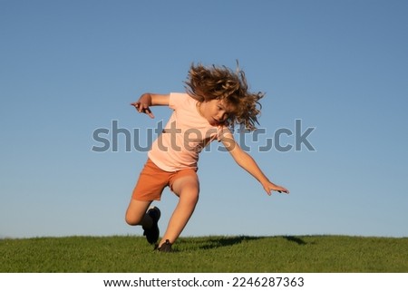 Kid falling down on the ground in summer park. Moment of the fall down. Little child tripped and falls down. Fall risk for children. Children outside activity. The moment of the fall.