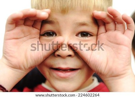 Similar – Child with reading magnifier