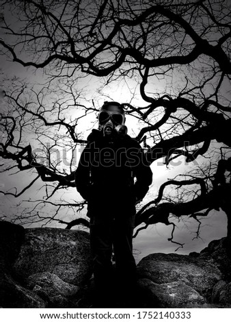 Kid with gasmask in the forest 