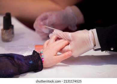 Kid Getting Nails Done At Teen Spa.